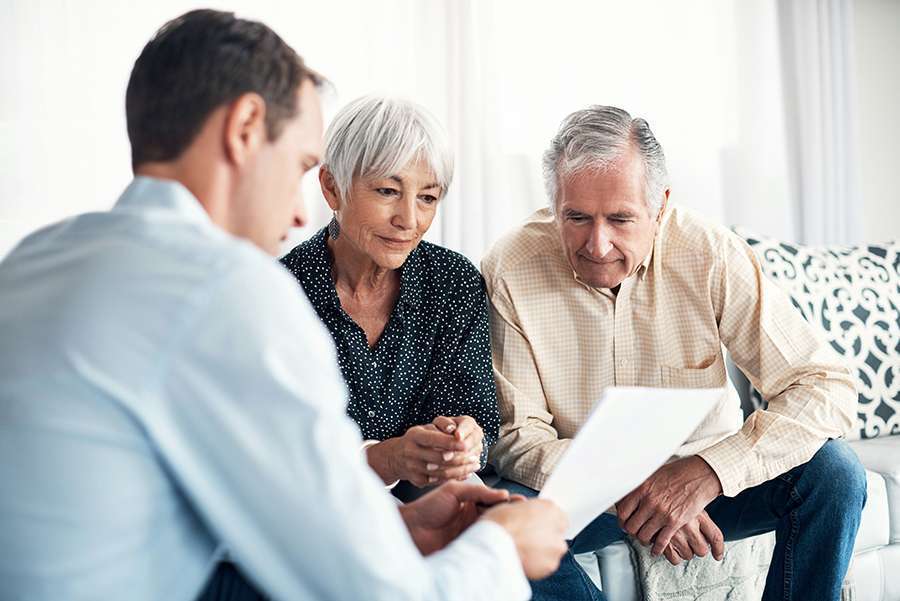 Debt relief specialist meeting with a couple to review their options
